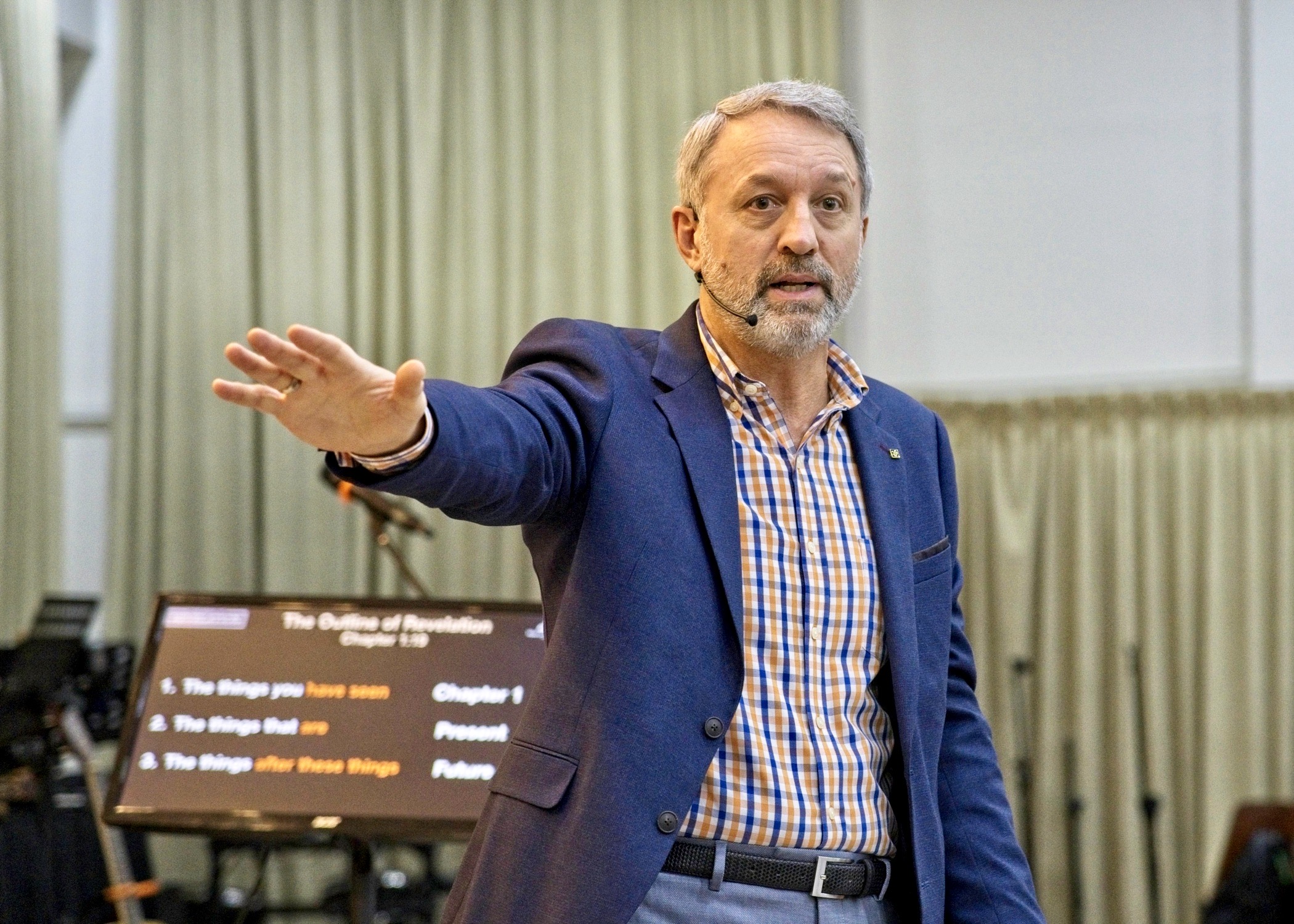 opened book on brown field during daytime
